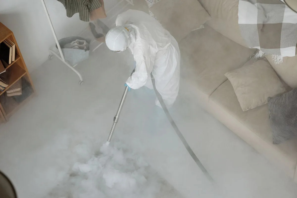 Biohazard cleanup technician in protective equipment, Lovejoy, GA